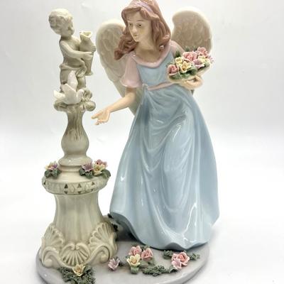 Porcelain Angel With Cherub Statue