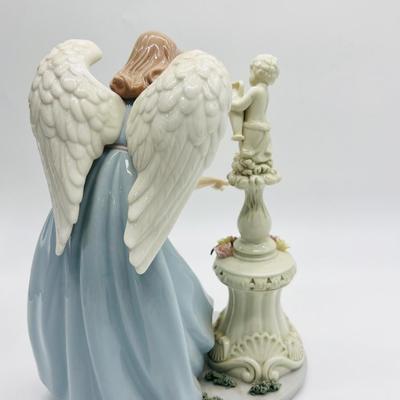 Porcelain Angel With Cherub Statue