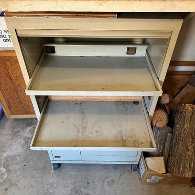 WRIGHT LINE CABINET W/ACCORDIAN DOOR AND DRAWER ON CASTERS