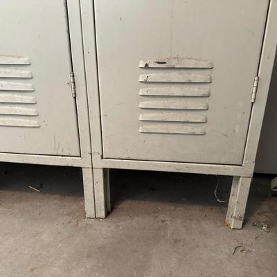 A SECTION OF 3 SCHOOL LOCKERS SLIGHTLY MODIFIED