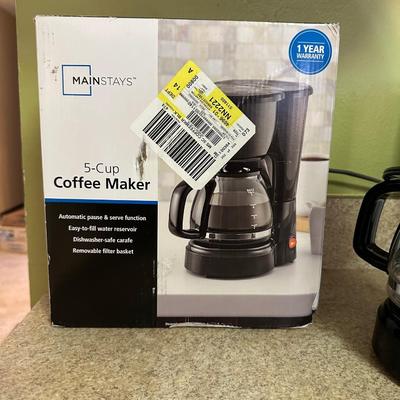 NEW COFFEE MAKER AND SEALED FOLGERS COFFEE