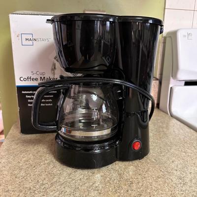NEW COFFEE MAKER AND SEALED FOLGERS COFFEE