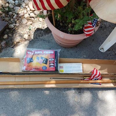 A VARIETY OF US FLAGS AND POLES