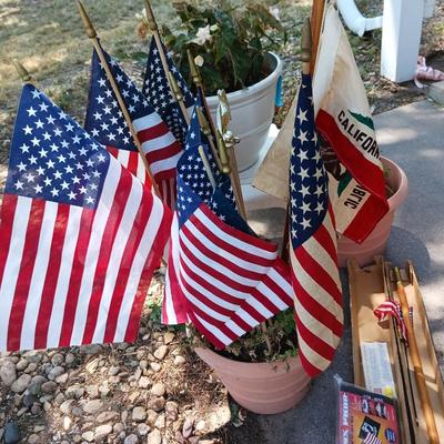 A VARIETY OF US FLAGS AND POLES