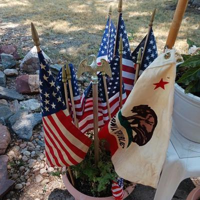 A VARIETY OF US FLAGS AND POLES