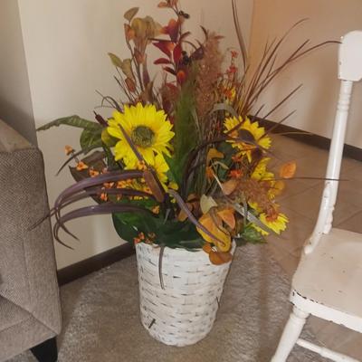 ANTIQUE ROCKING CHAIR AND FAUX FLOWERS IN A VASE