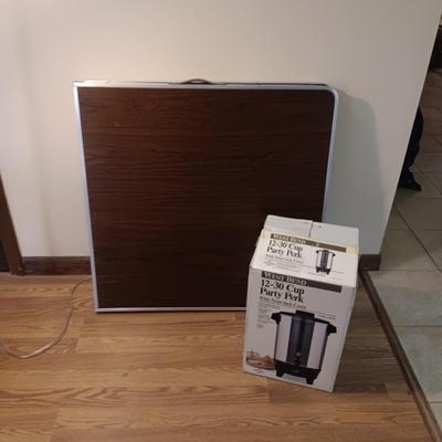 FOLDING 6 FOOT TABLE AND A 12 - 30 CUP PARTY PERK