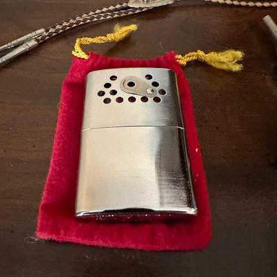 COMPASSES, BOLO TIE, BELT BUCKLE, HAND WARMER AND MORE