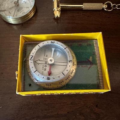 COMPASSES, BOLO TIE, BELT BUCKLE, HAND WARMER AND MORE