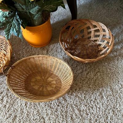 WICKER BASKETS AND FAUX FLOWERS IN A VASE