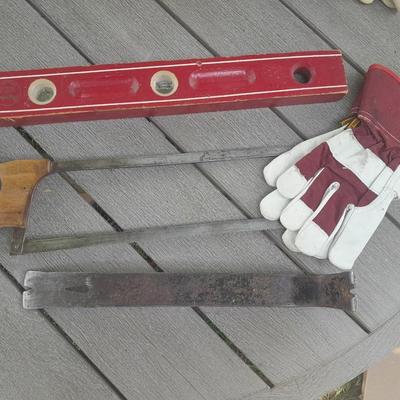 Antique wooden Peerless level with hand saw claw bar and leather gloves