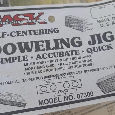 Task self-centering Doweling Jig Assortment of woodworking items and supplies