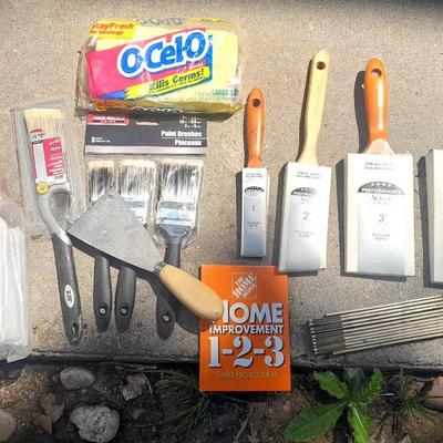 Brand new paint brushes and some other painting supplies