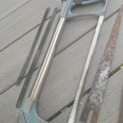 Hack saw with an assortment of files - one is nicely curved, and other small tools