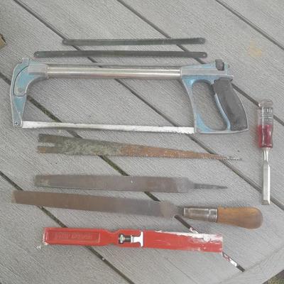 Hack saw with an assortment of files - one is nicely curved, and other small tools