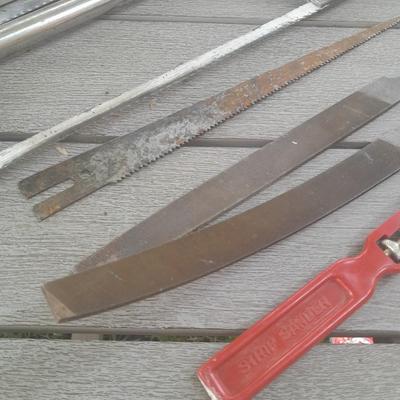 Hack saw with an assortment of files - one is nicely curved, and other small tools