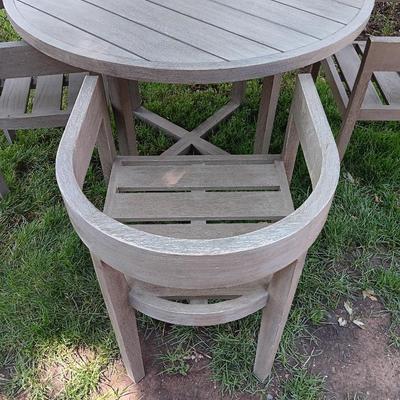48" round Port side patio table with four captain's chairs