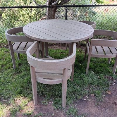 48" round Port side patio table with four captain's chairs