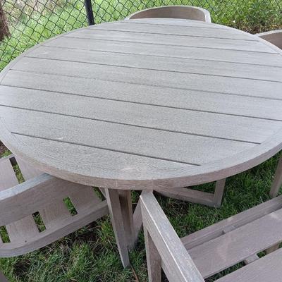 48" round Port side patio table with four captain's chairs