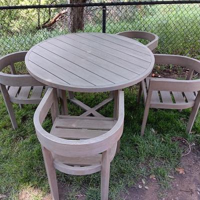 48" round Port side patio table with four captain's chairs