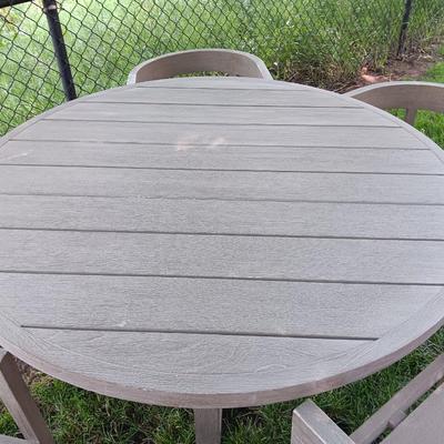 48" round Port side patio table with four captain's chairs