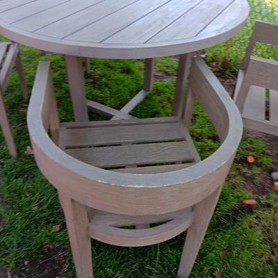 48" round Port side patio table with four captain's chairs