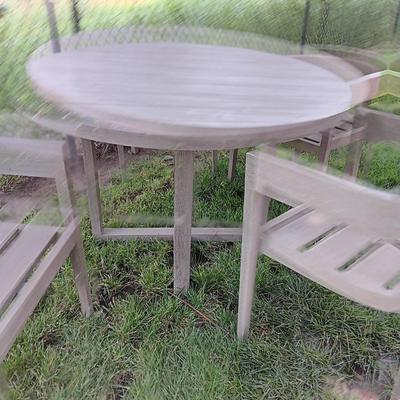 48" round Port side patio table with four captain's chairs