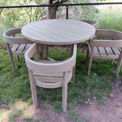 48" round Port side patio table with four captain's chairs