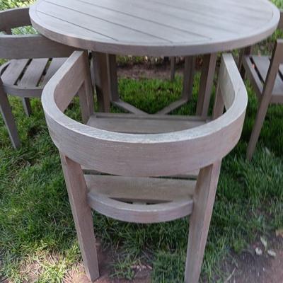 48" round Port side patio table with four captain's chairs