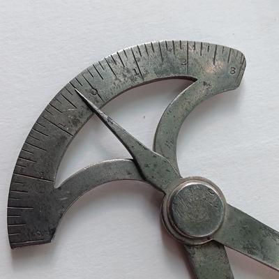 Antique calipers and small tape measure