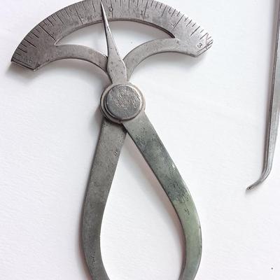 Antique calipers and small tape measure