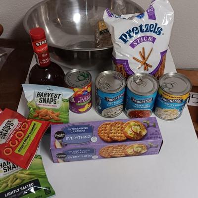 Large stainless-steel bowl full of groceries