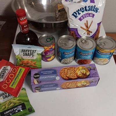 Large stainless-steel bowl full of groceries