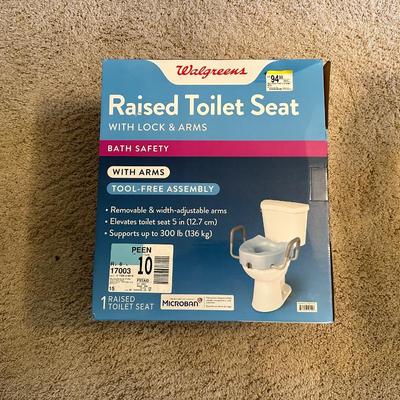 RAISED TOLIET SEAT WITH LOCK AND ARMS
