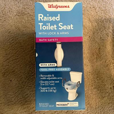 RAISED TOLIET SEAT WITH LOCK AND ARMS