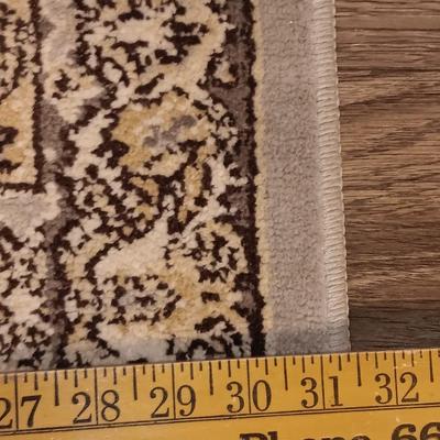 Antique gold framed mirror with a beautiful rubber backed throw rug