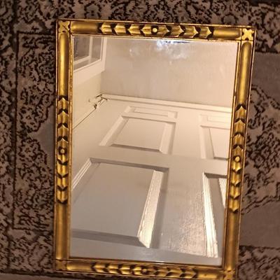 Antique gold framed mirror with a beautiful rubber backed throw rug
