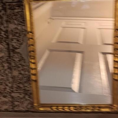 Antique gold framed mirror with a beautiful rubber backed throw rug