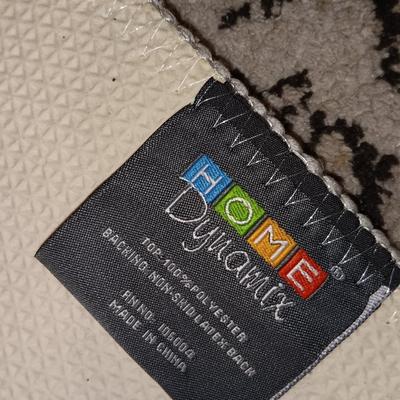 Antique gold framed mirror with a beautiful rubber backed throw rug