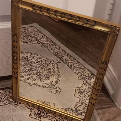 Antique gold framed mirror with a beautiful rubber backed throw rug
