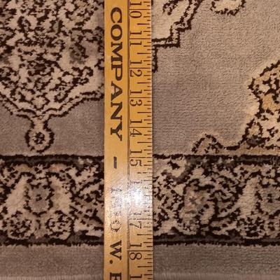 Antique gold framed mirror with a beautiful rubber backed throw rug