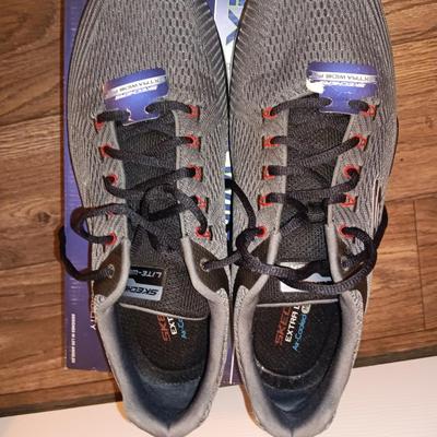 Brand new size 14 sketcher shoes and a pair of sketchers slippers