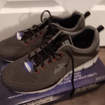 Brand new size 14 sketcher shoes and a pair of sketchers slippers