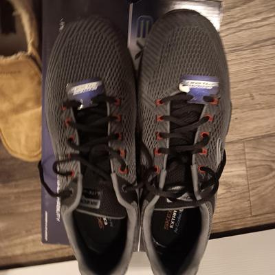 Brand new size 14 sketcher shoes and a pair of sketchers slippers