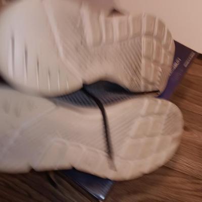 Brand new size 14 sketcher shoes and a pair of sketchers slippers