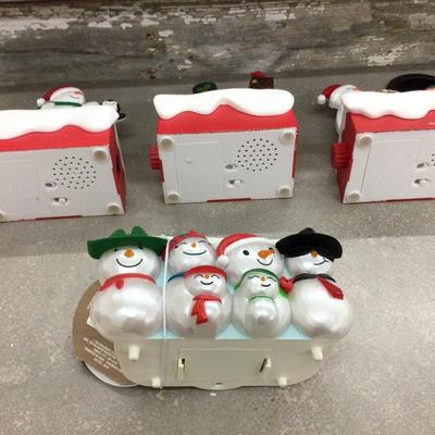 Hallmark Talking Snowmen Set of Three and A Group of Snowmen.