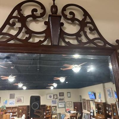 Beveled mirror with decorarative wood frame