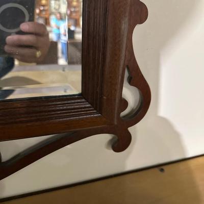 Beveled mirror with decorarative wood frame