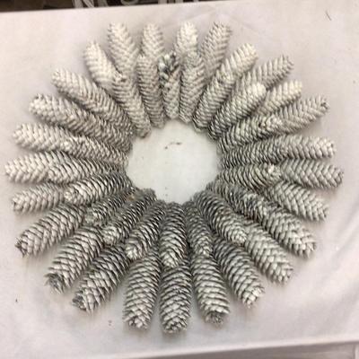 Tube of Holiday Wreaths and Lighted Christmas Tree
