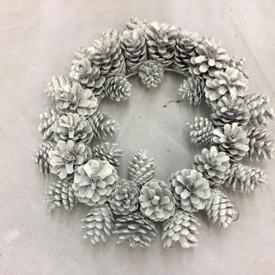 Tube of Holiday Wreaths and Lighted Christmas Tree